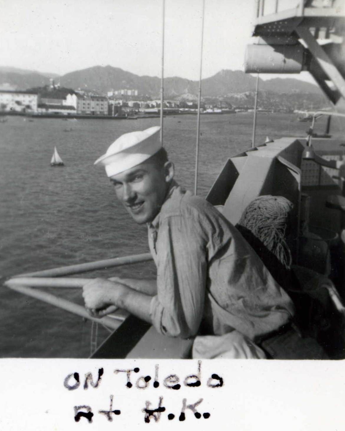 A person in a white hat on a boat
Description automatically generated